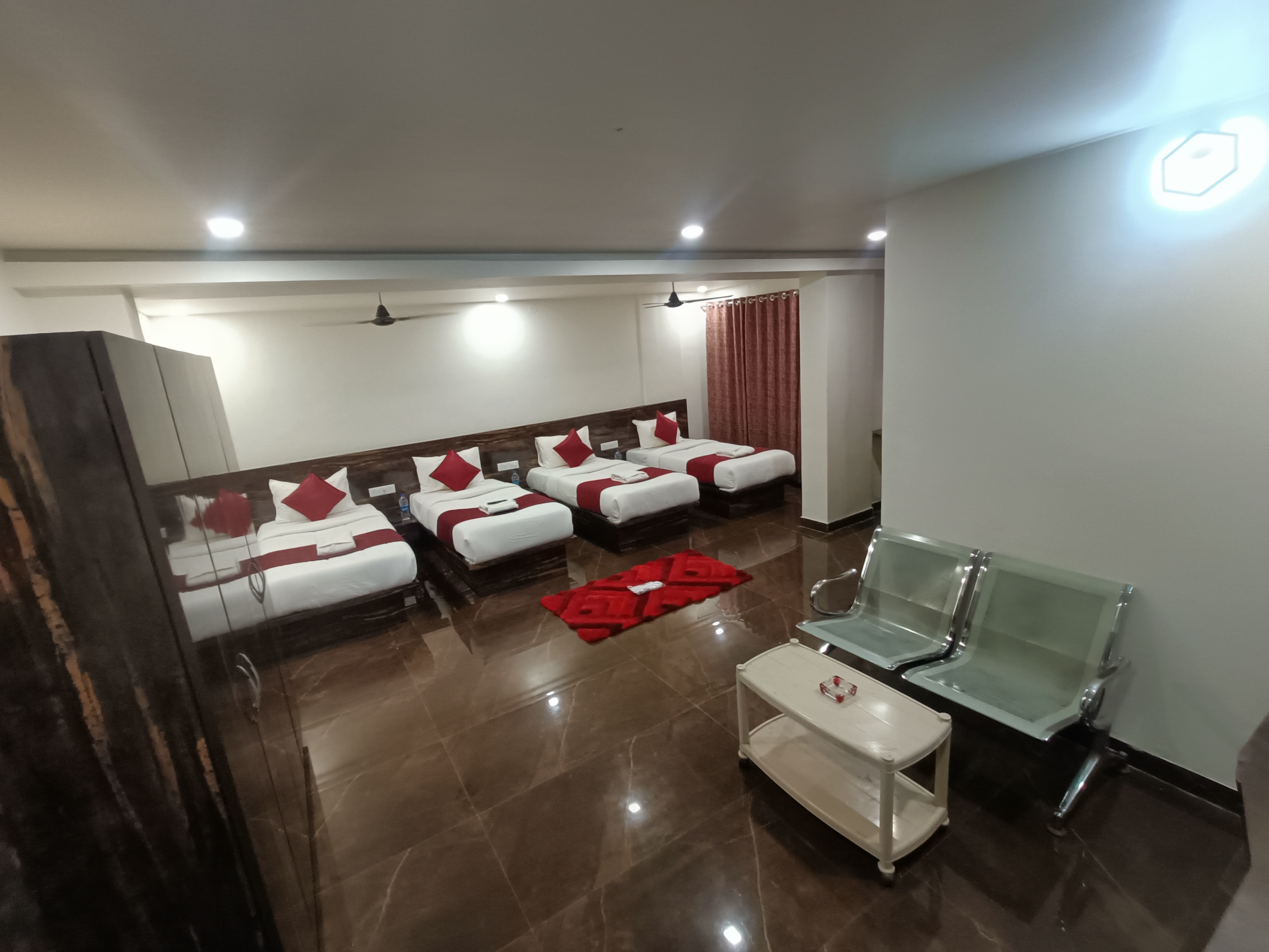 Four Bedded Family Non AC are ideal for Family, Tourist, Business travelers, VIP Guest, even a Family for marriage functions in a Spacious room measuring approx. 420 sq ft. A perfect blend of Luxury with furnished 1 Rooms provide you 4 Single Bed, Living 